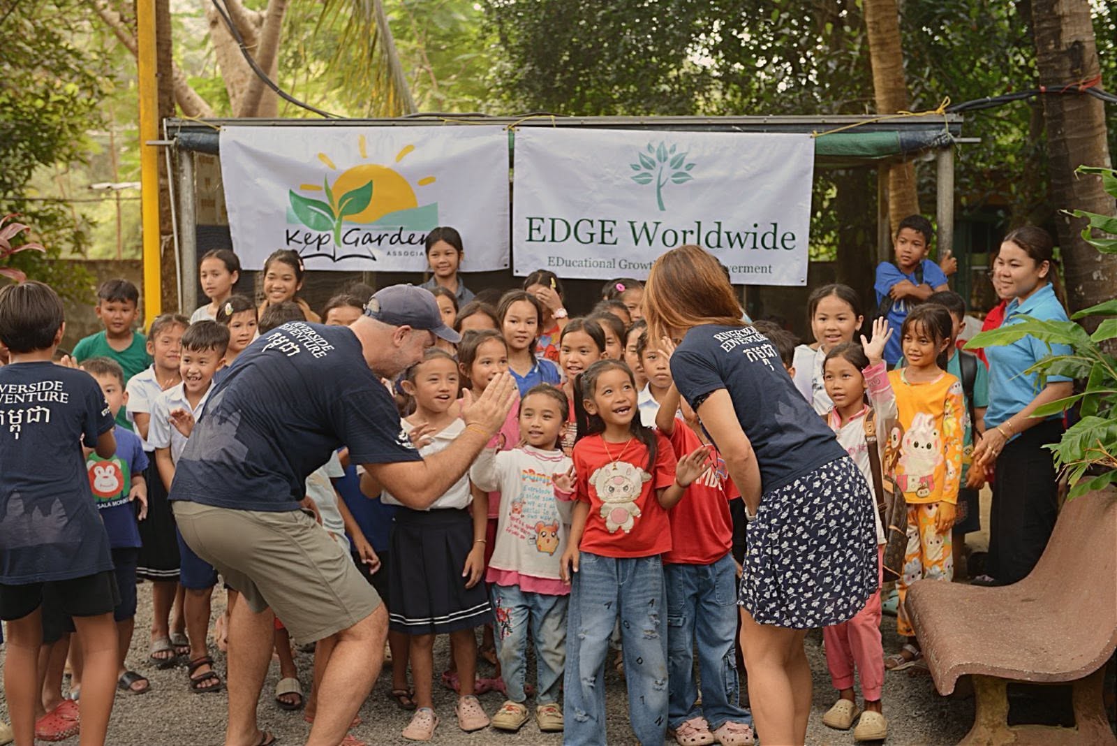 Jamie Christopherson with children at an EDGE Worldwide and Kep Gardens programme in Cambodia