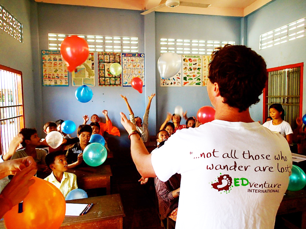 Jamie Christopherson leading an EDventure International classroom activity with balloons in Cambodia